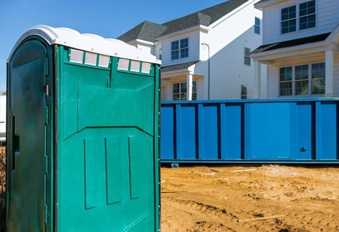 construction team convenience provided by portable toilets on site